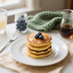 Make these coconut flour pancakes for your best batch yet. They use only 4 main ingredients plus a small amount of coconut oil, so they stay grain-free, dairy-free, and refined sugar free.